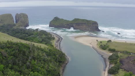 drone over water canal leading into ocean hole in wall transkei beach, south africa