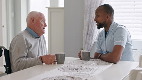 caregiver assisting elderly man at home