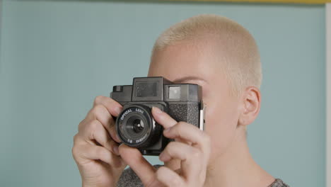 female photographer poses with vintage camera 06