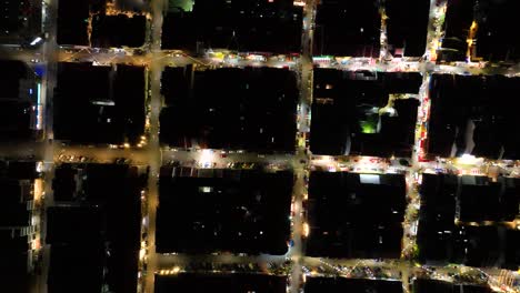 aerial top down penang little india, george town malaysia, square street blocks at night