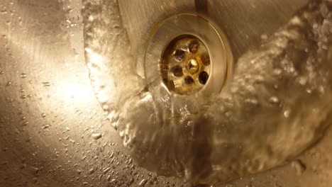 water draining into a kitchen sink