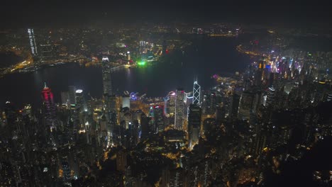 noche iluminada hong kong centro de la bahía panorama aéreo 4k china