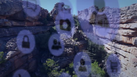 social media icons animation over rocky landscape with trees and cliffs