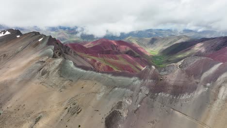 Aerial-fly-drone-view-of-Rainbow-Mountain-,-Vinicunca,-Cusco-Region,-Peru