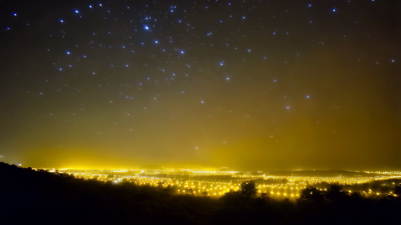 City at Night Under a Starry Sky