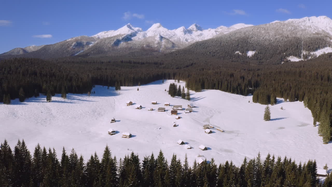 Snowy Mountain Village with Wooden Cabins