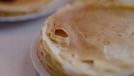 close-up of freshly baked pancakes in kitchen on plate