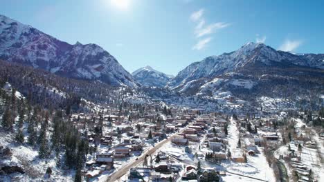 Drone-footage-of-Ouray,-Colorado-in-the-winter-on-a-sunny-day