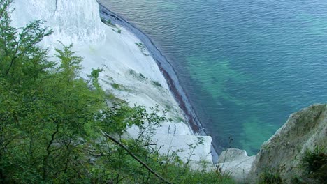 a secluded lagoon at the bottom of denmark's white chalk cliffs, mons klint