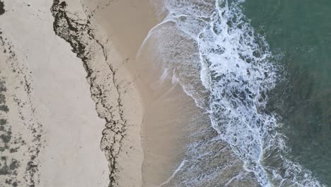 Breaking-waves-in-an-empty-white-sand-beach-in-Galicia,-Spain