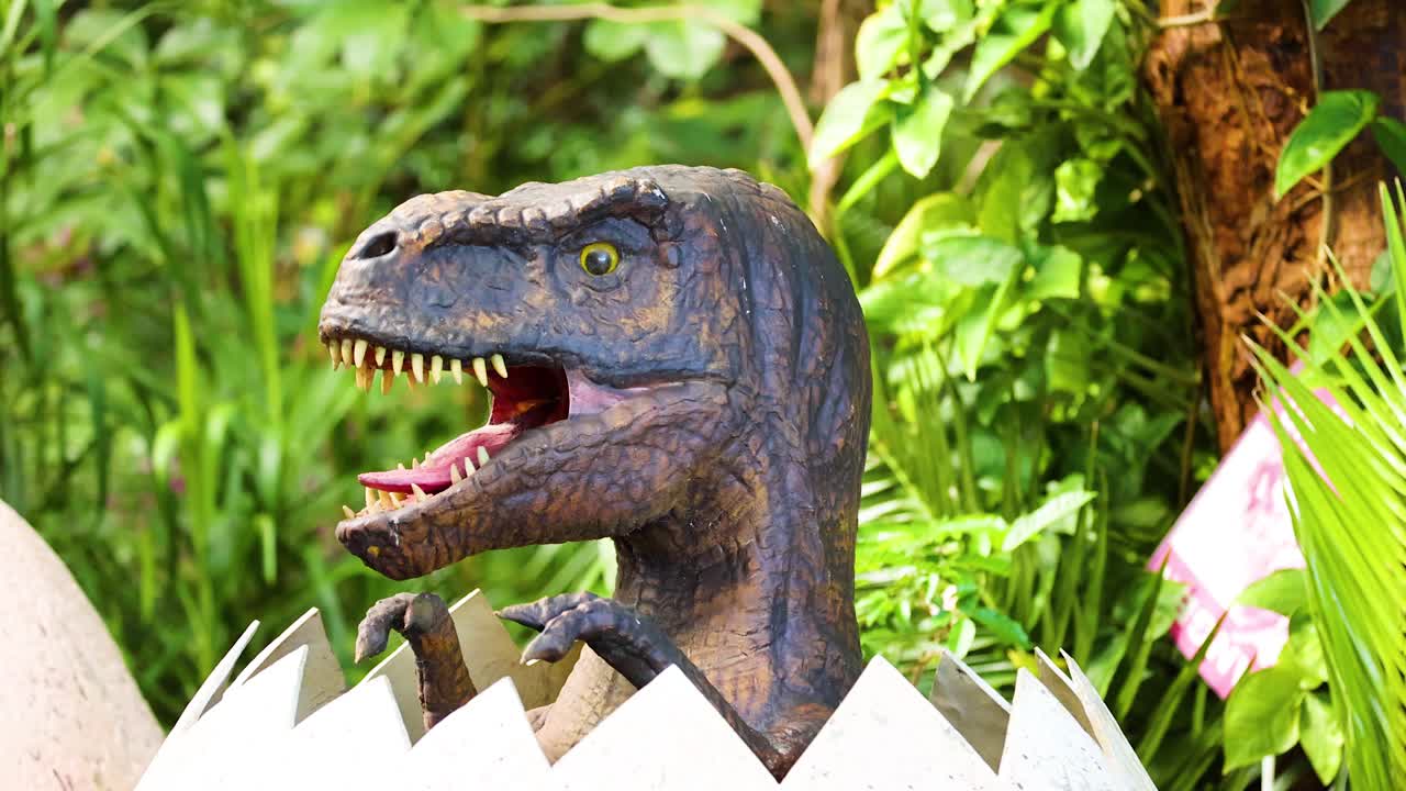 A dinosaur animatronic hatches from an egg in a vibrant, green environment with dynamic lighting and playful mood