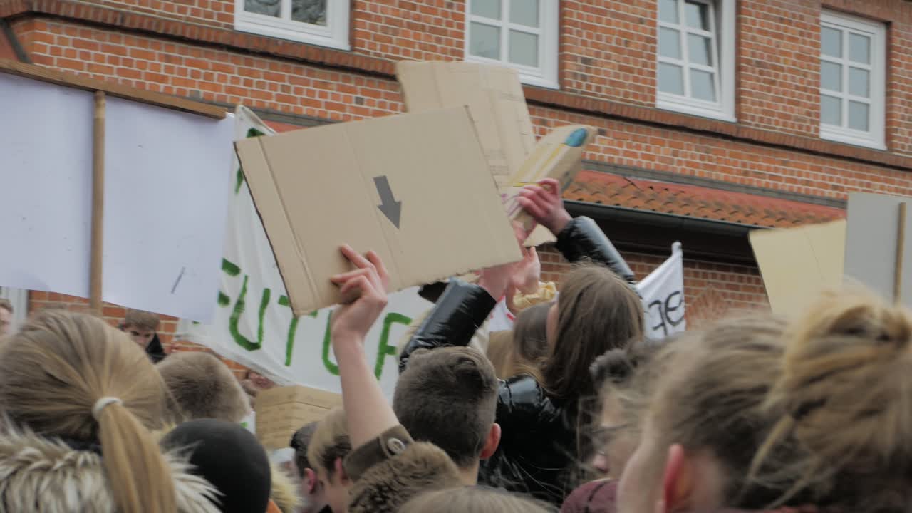 young people demonstrating for enviromental protection