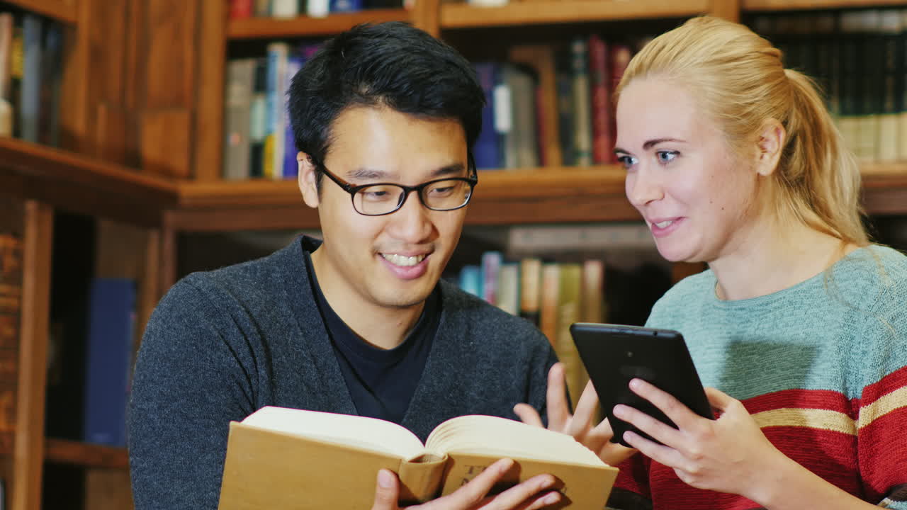Smiling Korean Man Talking To A Woman In The Library 1