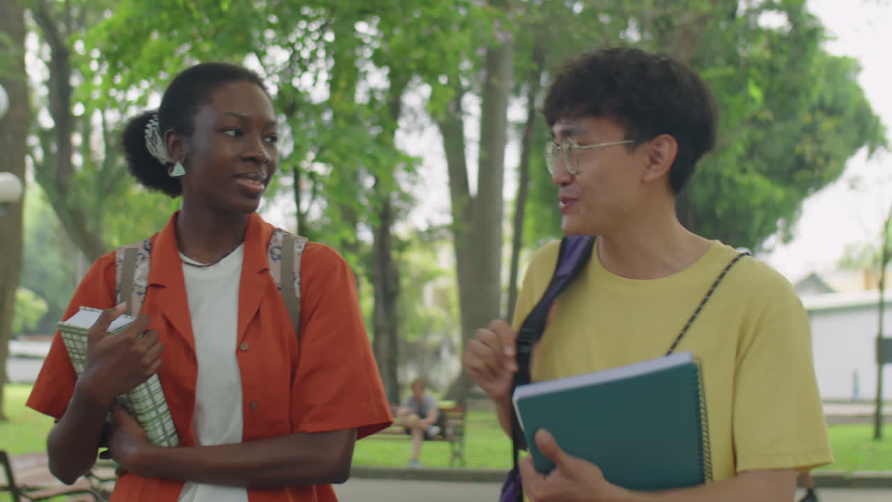 Diverse Students Walking and Chatting in Park