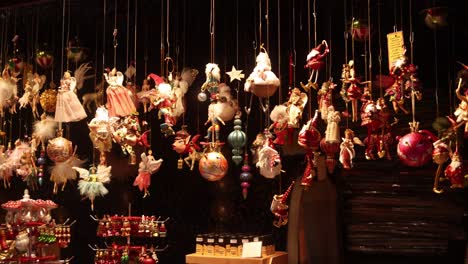 ornaments hanging in a shop stall in streasbourg at a festive christmas market in europe