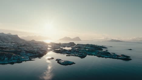 bright sunset sky illuminated skarungen camping site in lofoten islands, norway. aerial drone shot