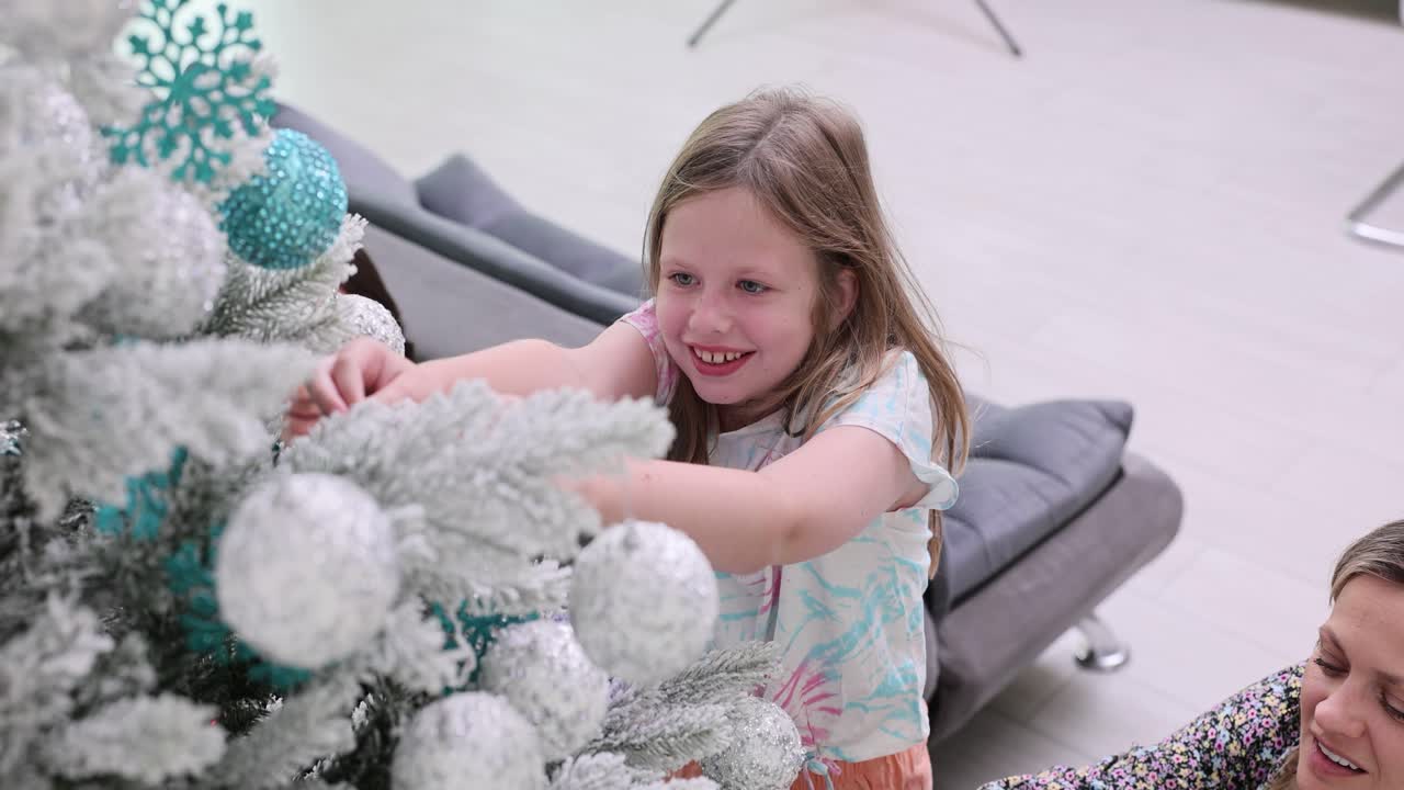 Family decorates Christmas tree