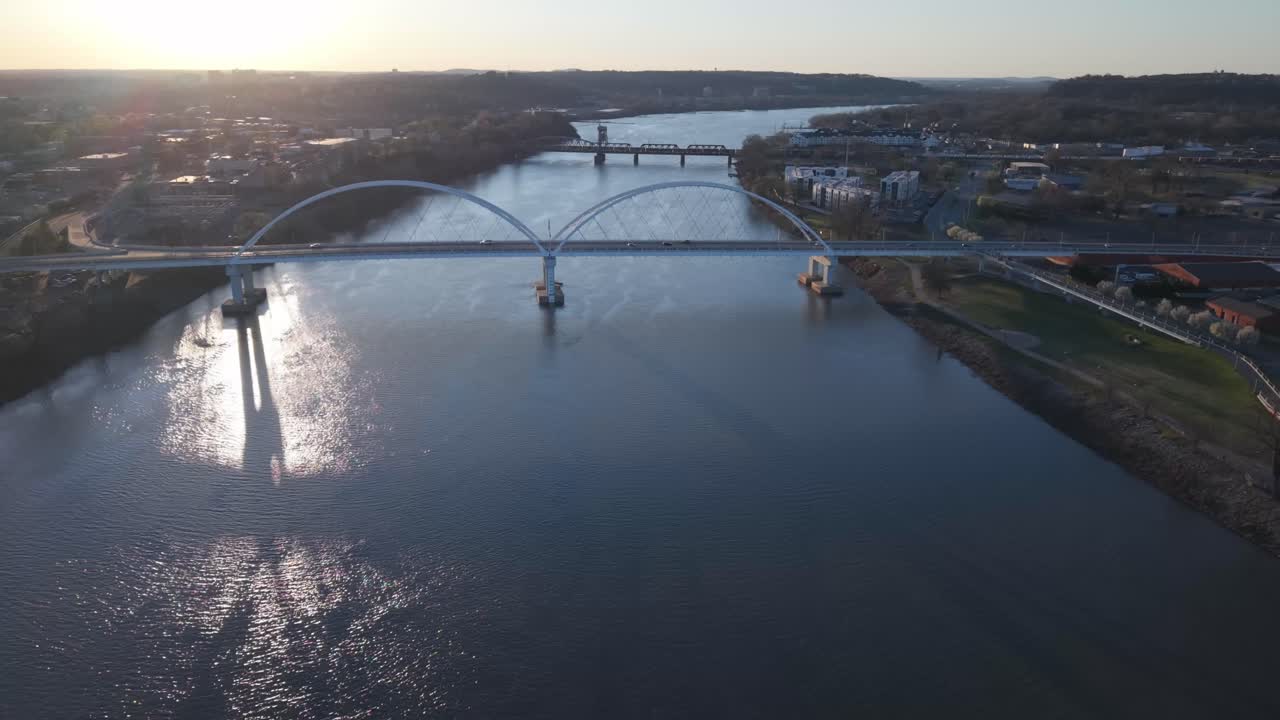 Cars Driving Over The Broadway Bridge Spanning The Arkansas River In Little Rock At Sunrise, Drone view
