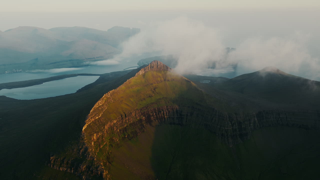 Cloud-Kissed Mountains and Fjord at Golden Hour