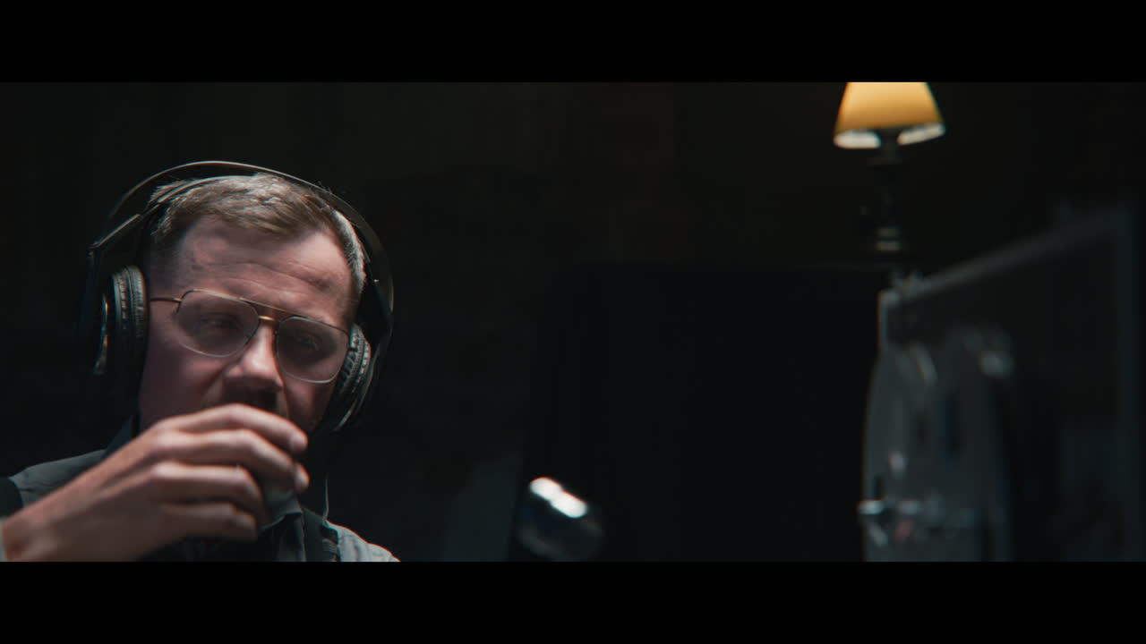 An intelligence officer listens to the wiretap recordings