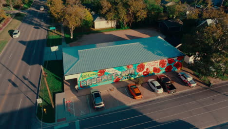 aerial drone flyover popular tourist photo op in georgetown, texas, "greetings from georgetown" mural art