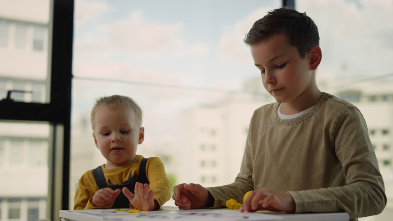 Siblings playing indoors