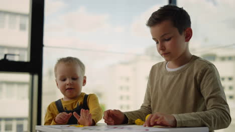 siblings playing indoors