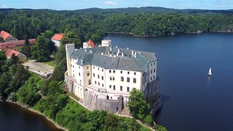orlik castle (zamek orlik) - manor house by vltava river in summer in orlik nad vltavou, pisek, czech republic. - aerial shot