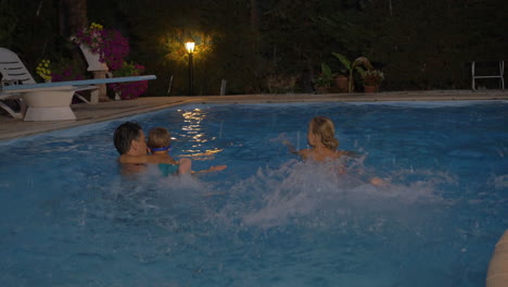 parents teaching son to swim