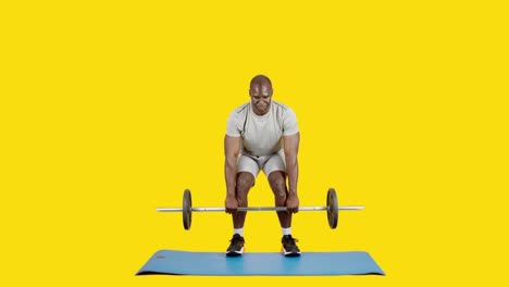 african man doing row exercise with bar and weights