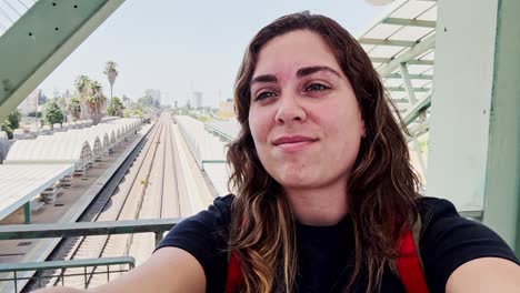 female influencer taking a travel selfie for social media