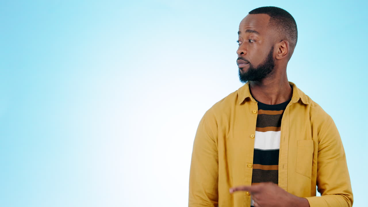 Pointing, mockup and face of black man on blue