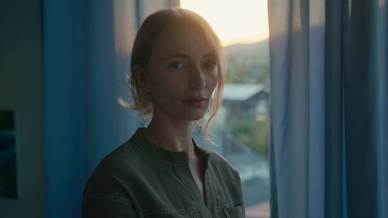 Woman by the Window at Sunset