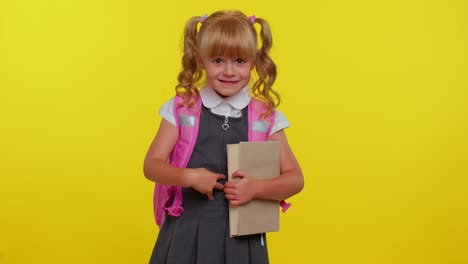 happy little teenage girl kid in school uniform celebrate success win doing winner gesture say yes