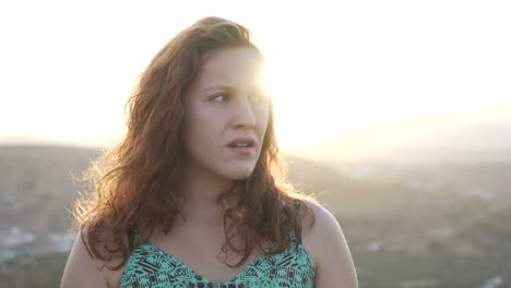 a woman with red hair in sunlight