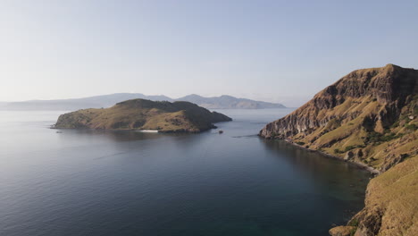 tranquil beach at padar island during misty morning in flores, indonesia