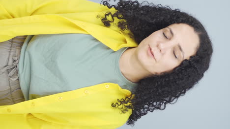 Vertical-video-of-Tired-looking-young-woman.