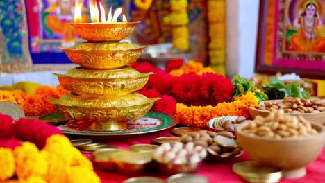 indian religious ceremony with diyas and offerings