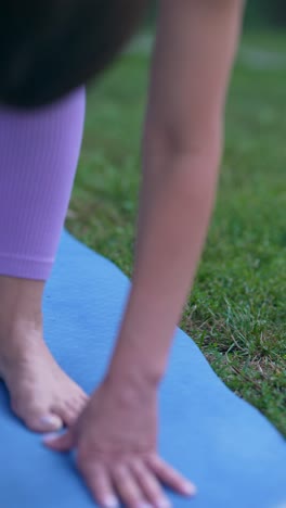 woman practicing yoga outdoors