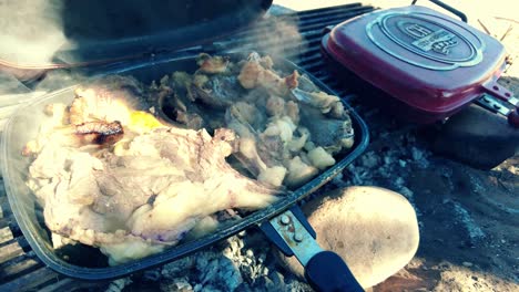 grilled-lamb-chops-barbecued-over-embers-in-the-middle-of-the-desert-in-bivouac