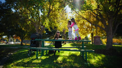 mother and daughters enjoying a sunny day in the park
