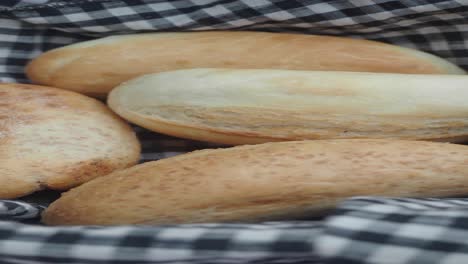 close up of fresh baked rolls in a basket