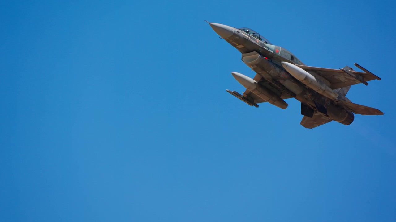 Fighter jet climbing steeply after takeoff