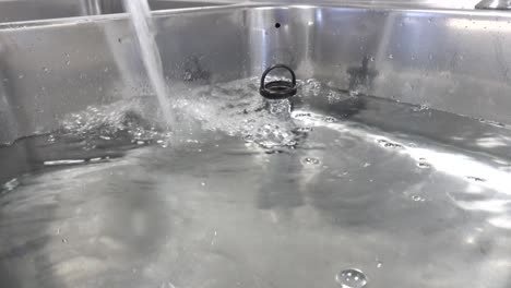 a washbasin is filled with clear water