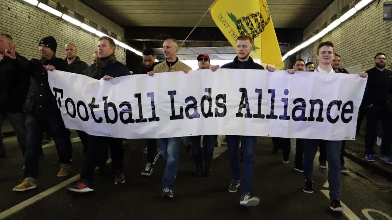 UK March 2018 - Protestors march holding a banner of the far right group Football Lads Alliance in Birmingham.