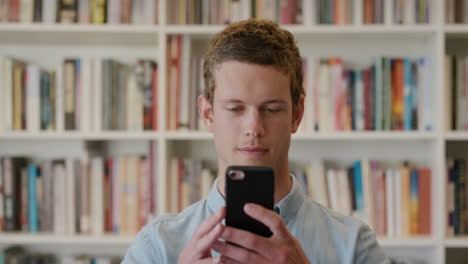 portrait attractive young man using smartphone texting browsing online enjoying sending messages on mobile phone slow motion