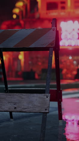 a close-up of a barricade in a city street at night