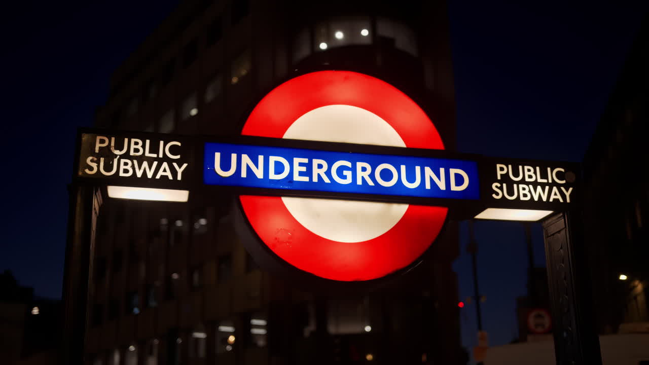 Close up of an Underground sign capturing urban London, England life at night