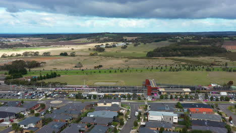 AERIAL-Passenger-Train-Stopped-At-Newly-Built-Train-Station