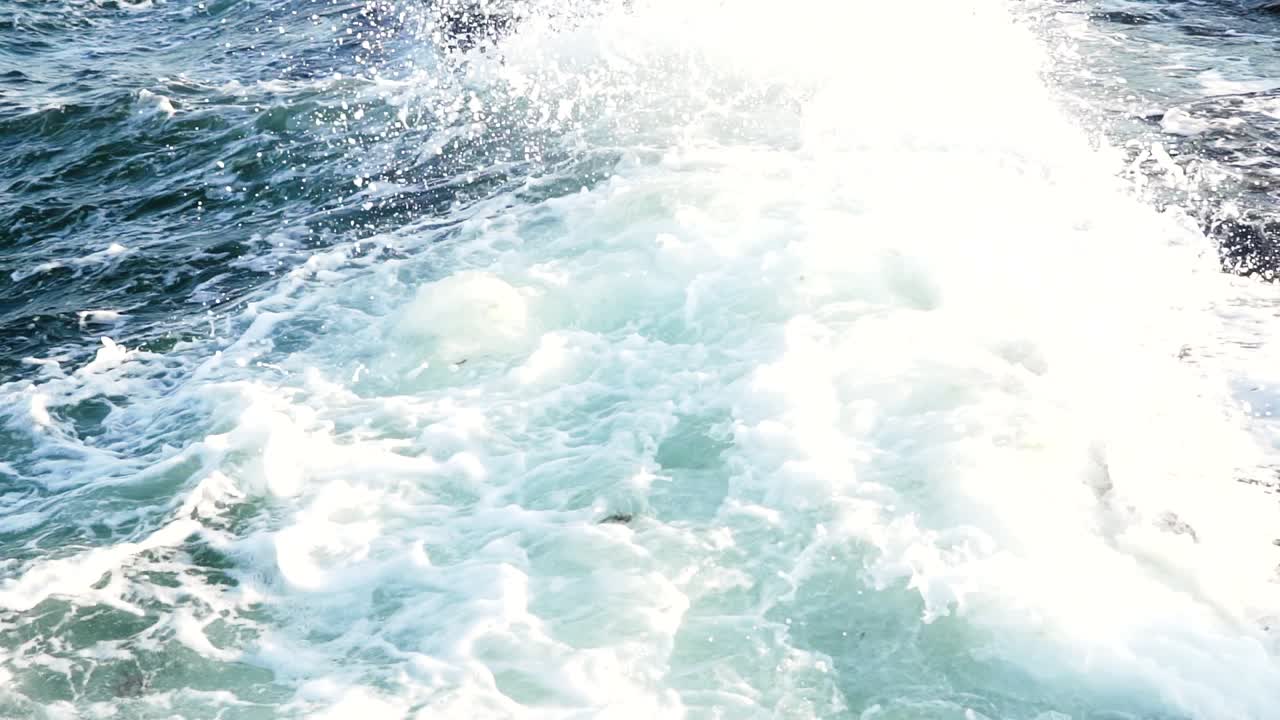 Wave breaking on rocks. Big waves crash into the rocks